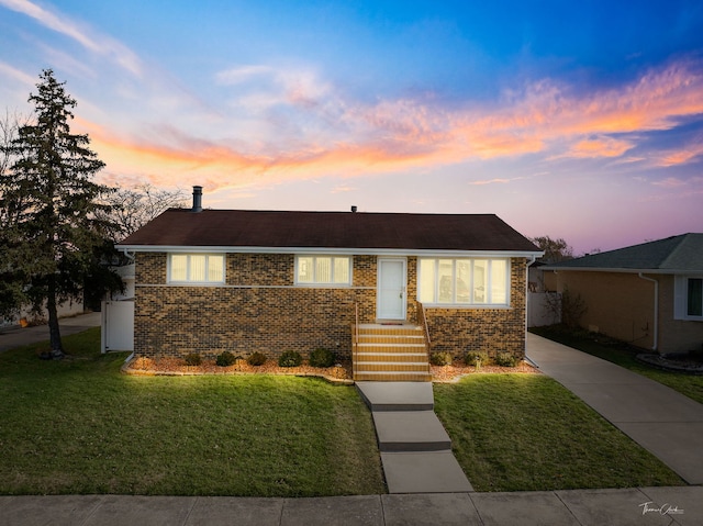 ranch-style house featuring a yard