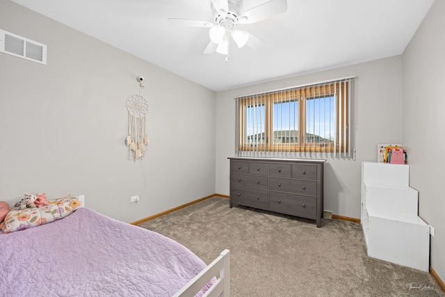 bedroom with ceiling fan and light colored carpet