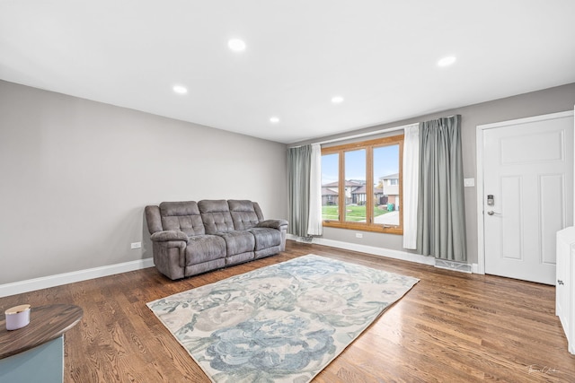 living room with dark wood-type flooring