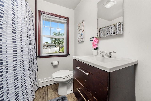 3820 W 117th St, Alsip, IL 60803 - full bathroom featuring wood finished floors, a baseboard heating unit, and vanity