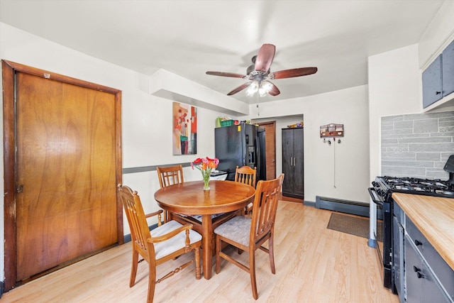 3820 W 117th St, Alsip, IL 60803 - dining area with a baseboard radiator, light wood-type flooring, and ceiling fan