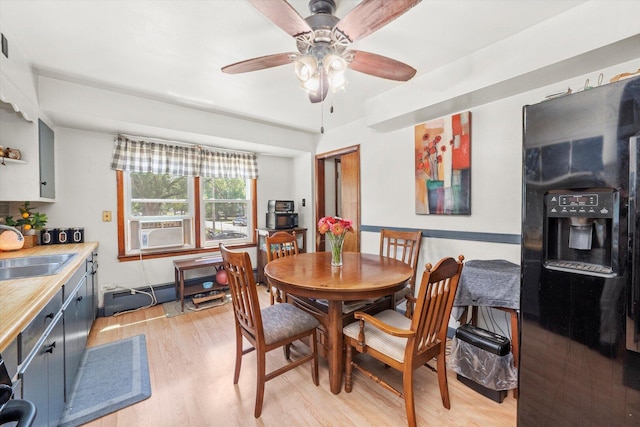 3820 W 117th St, Alsip, IL 60803 - dining area with light wood-style floors, a ceiling fan, and cooling unit