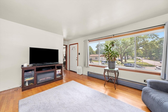 3820 W 117th St, Alsip, IL 60803 - living room featuring a baseboard radiator and wood finished floors
