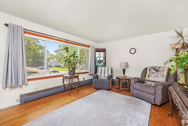3820 W 117th St, Alsip, IL 60803 - living area featuring a baseboard radiator and wood finished floors