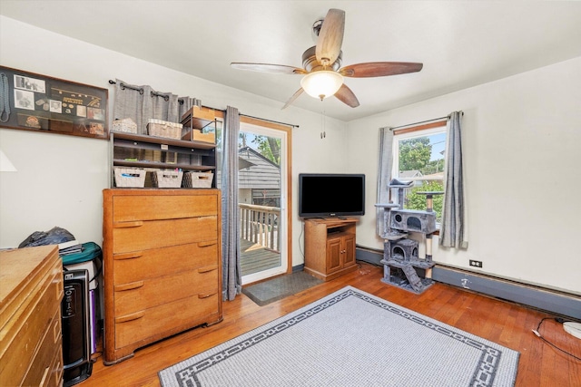 3820 W 117th St, Alsip, IL 60803 - living area with healthy amount of natural light, light wood-type flooring, and a ceiling fan