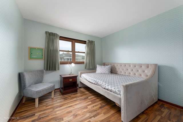 bedroom with hardwood / wood-style flooring