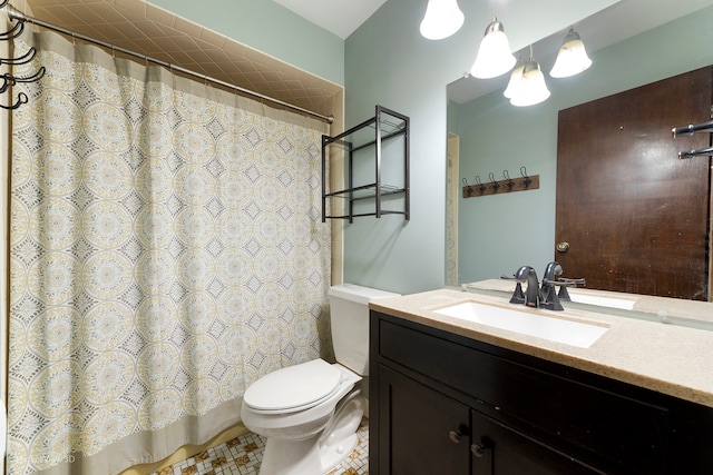 bathroom featuring a shower with curtain, vanity, and toilet