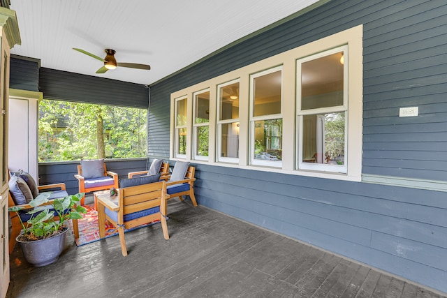 wooden deck featuring ceiling fan