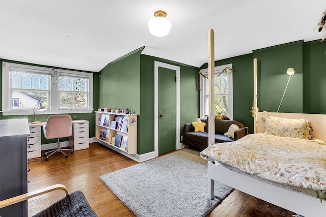 bedroom with hardwood / wood-style flooring