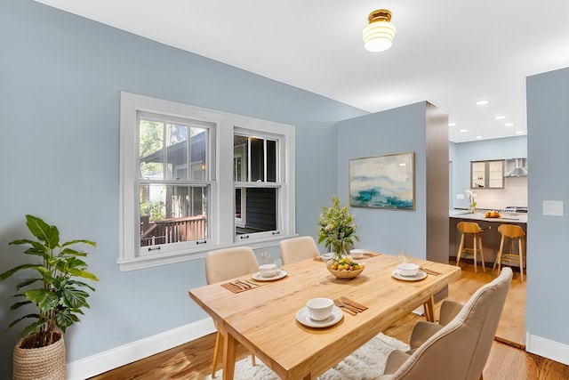 dining area with light hardwood / wood-style floors