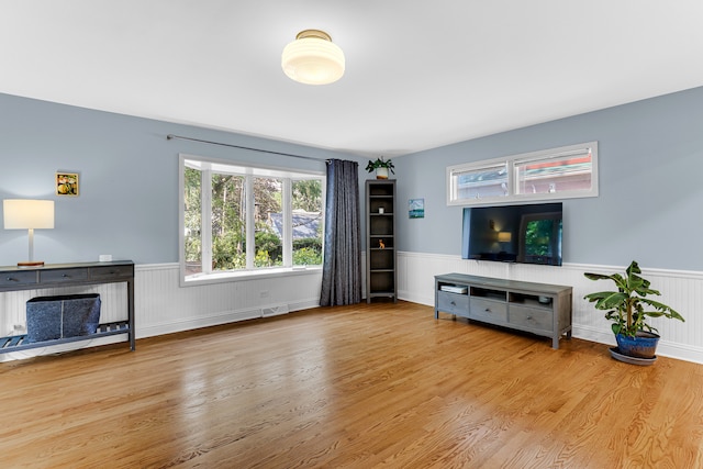 living room with light hardwood / wood-style flooring