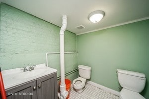 bathroom featuring vanity and toilet