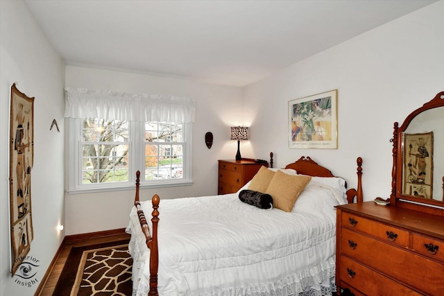 bedroom with hardwood / wood-style floors