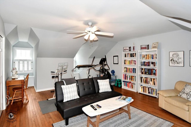 living room featuring ceiling fan, lofted ceiling, and hardwood / wood-style flooring