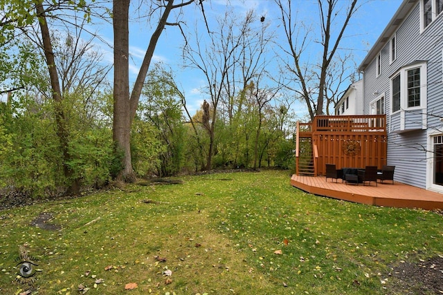 view of yard with an outdoor living space and a deck