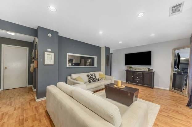 living room with light hardwood / wood-style floors