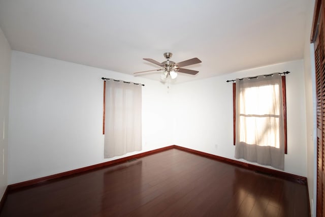 spare room with hardwood / wood-style flooring and ceiling fan