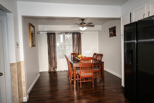 dining area featuring ceiling fan and dark hardwood / wood-style flooring