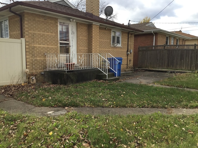 view of property exterior featuring a lawn