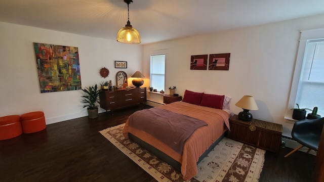 bedroom featuring dark hardwood / wood-style flooring