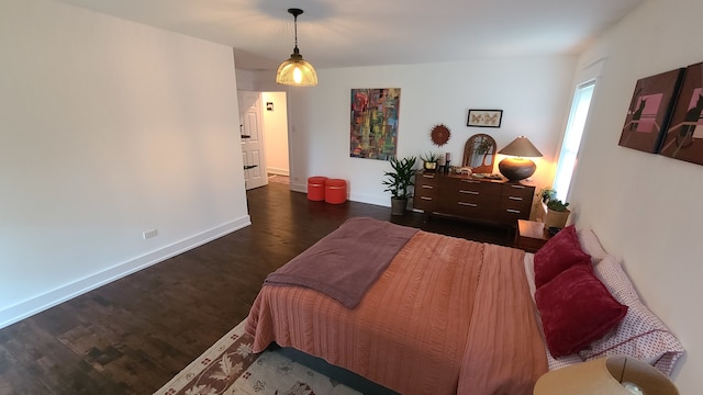 bedroom featuring dark hardwood / wood-style flooring