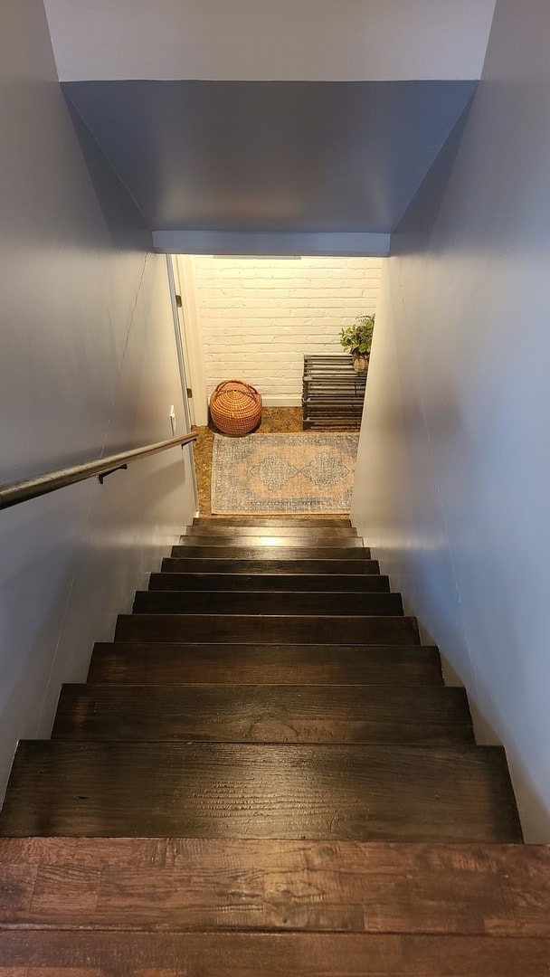 staircase featuring hardwood / wood-style floors