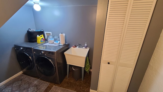 clothes washing area featuring washing machine and dryer