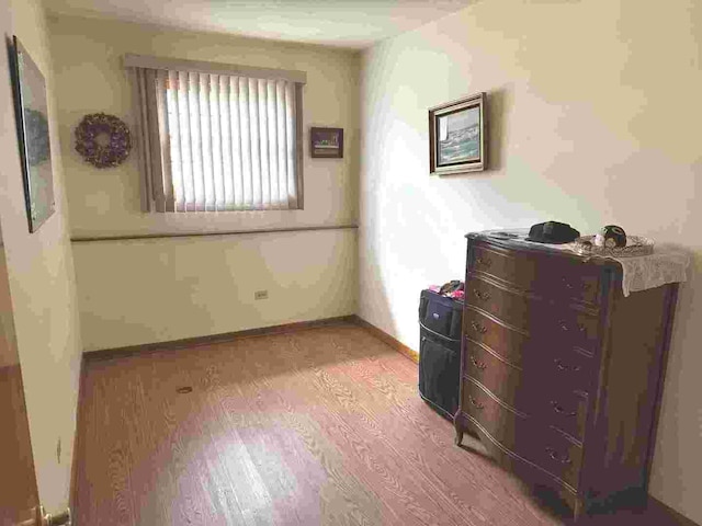 bedroom with light wood-type flooring