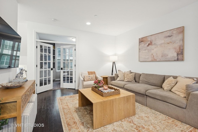 living room with french doors and dark hardwood / wood-style floors