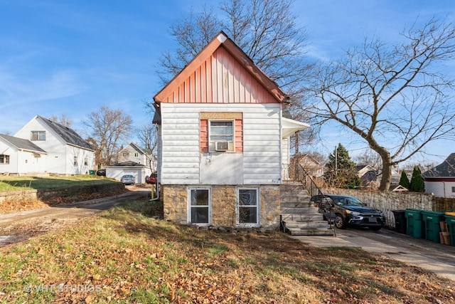 view of property exterior with a lawn and cooling unit