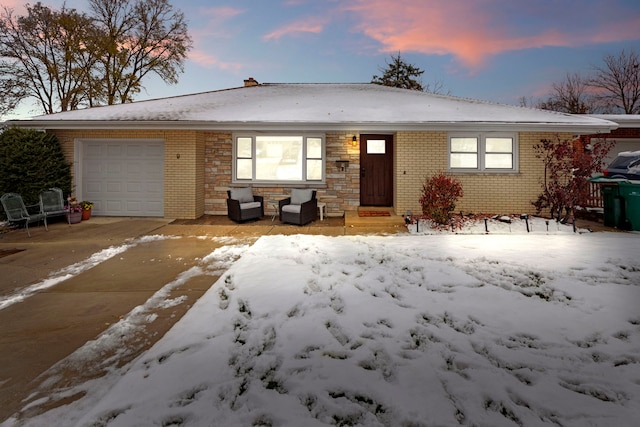 ranch-style house featuring a garage