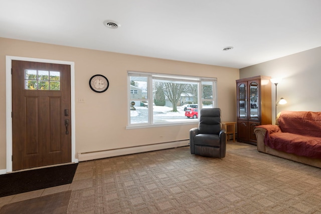 carpeted entrance foyer featuring a baseboard radiator