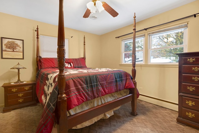 bedroom with carpet flooring, ceiling fan, and baseboard heating