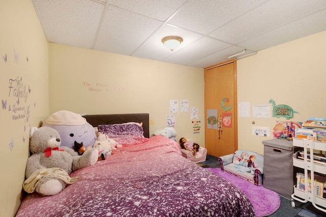 bedroom with a paneled ceiling