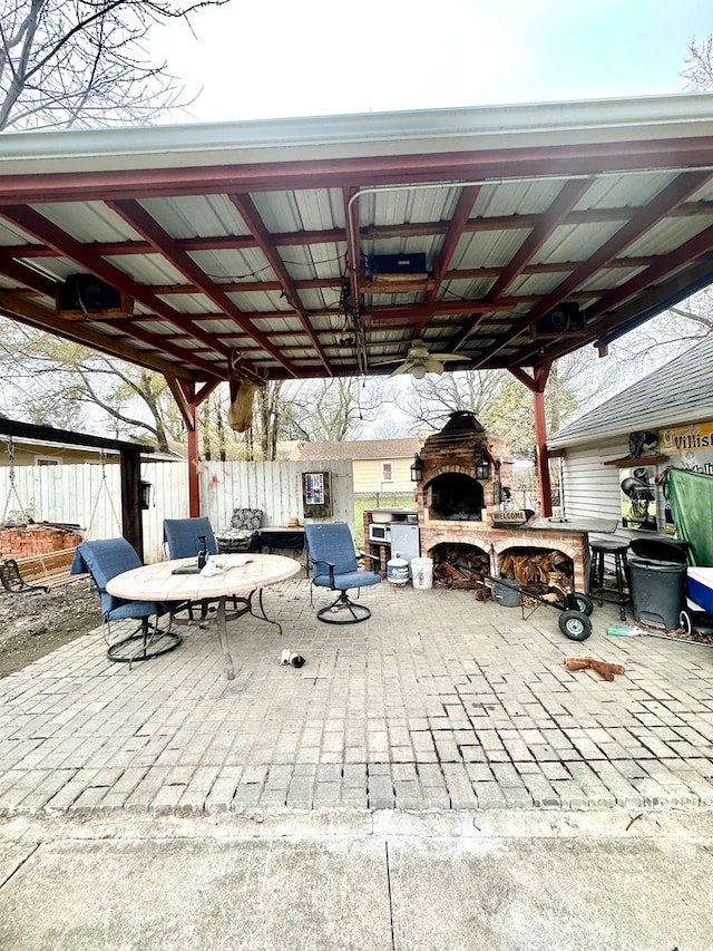 view of patio / terrace featuring a fireplace