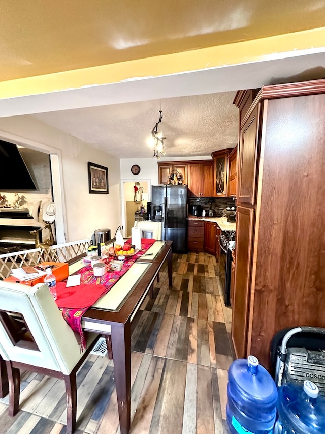 dining space featuring dark wood-type flooring