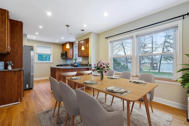 dining room with light wood-type flooring