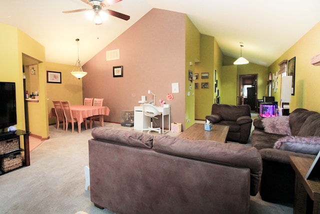 living room featuring ceiling fan, light colored carpet, and lofted ceiling