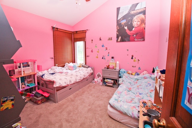 bedroom featuring light colored carpet and lofted ceiling