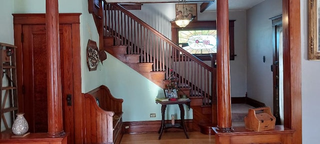 staircase featuring wood-type flooring