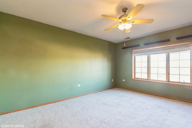 unfurnished room featuring carpet flooring and ceiling fan