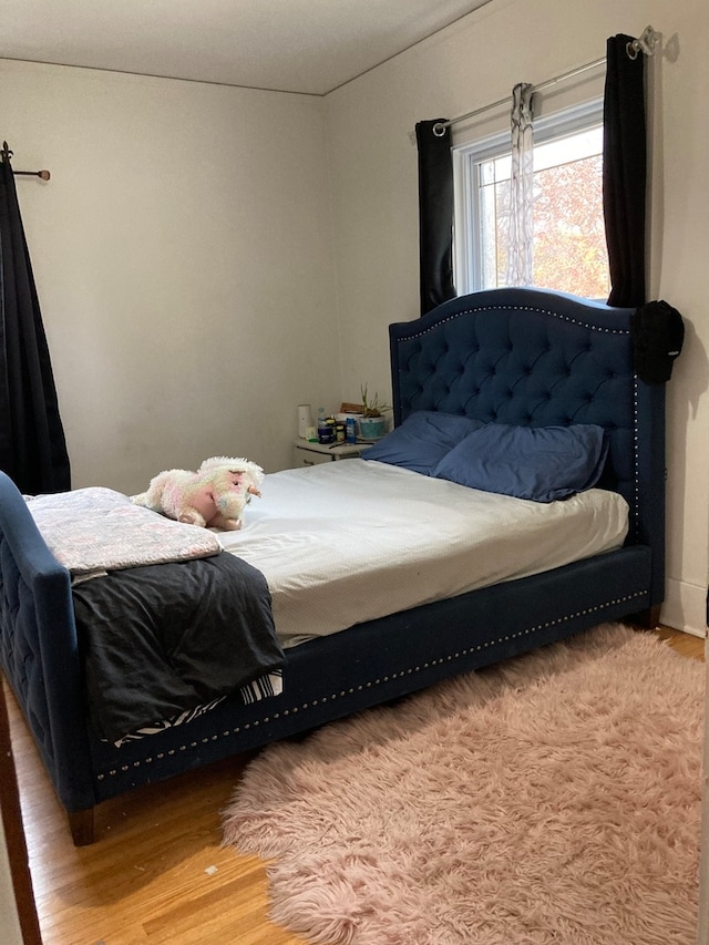 bedroom featuring hardwood / wood-style floors