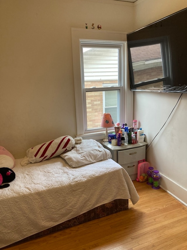 bedroom with light hardwood / wood-style floors