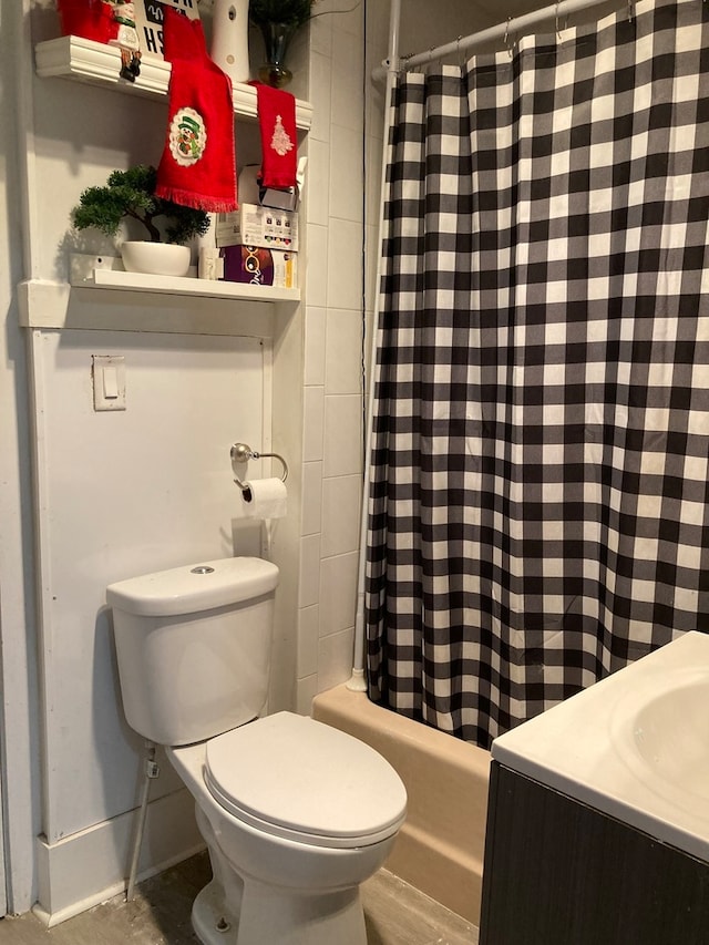 full bathroom featuring vanity, toilet, and shower / bath combo with shower curtain