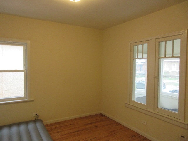 empty room featuring wood-type flooring