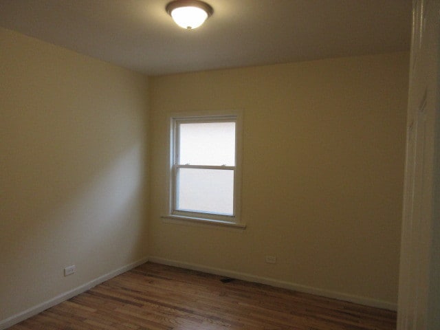 empty room featuring dark hardwood / wood-style floors