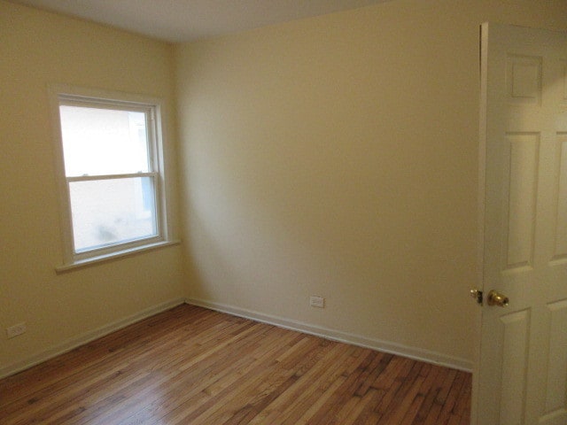 empty room featuring hardwood / wood-style floors