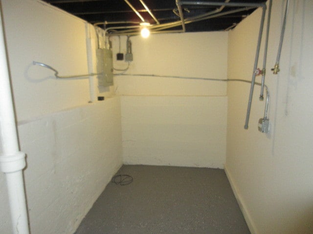 basement featuring electric panel