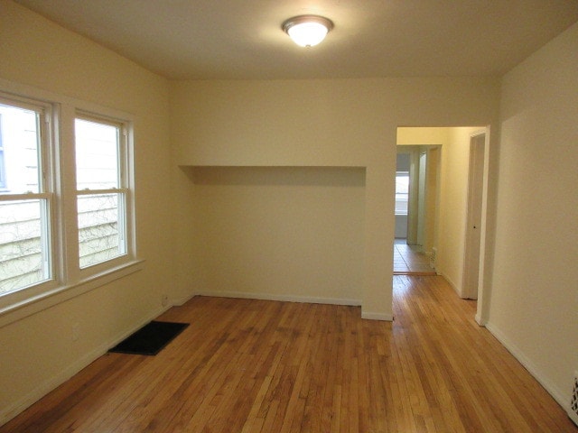 unfurnished room featuring light wood-type flooring