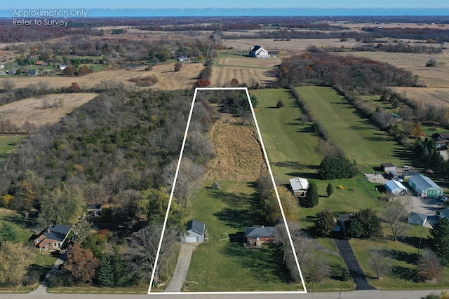 birds eye view of property featuring a rural view